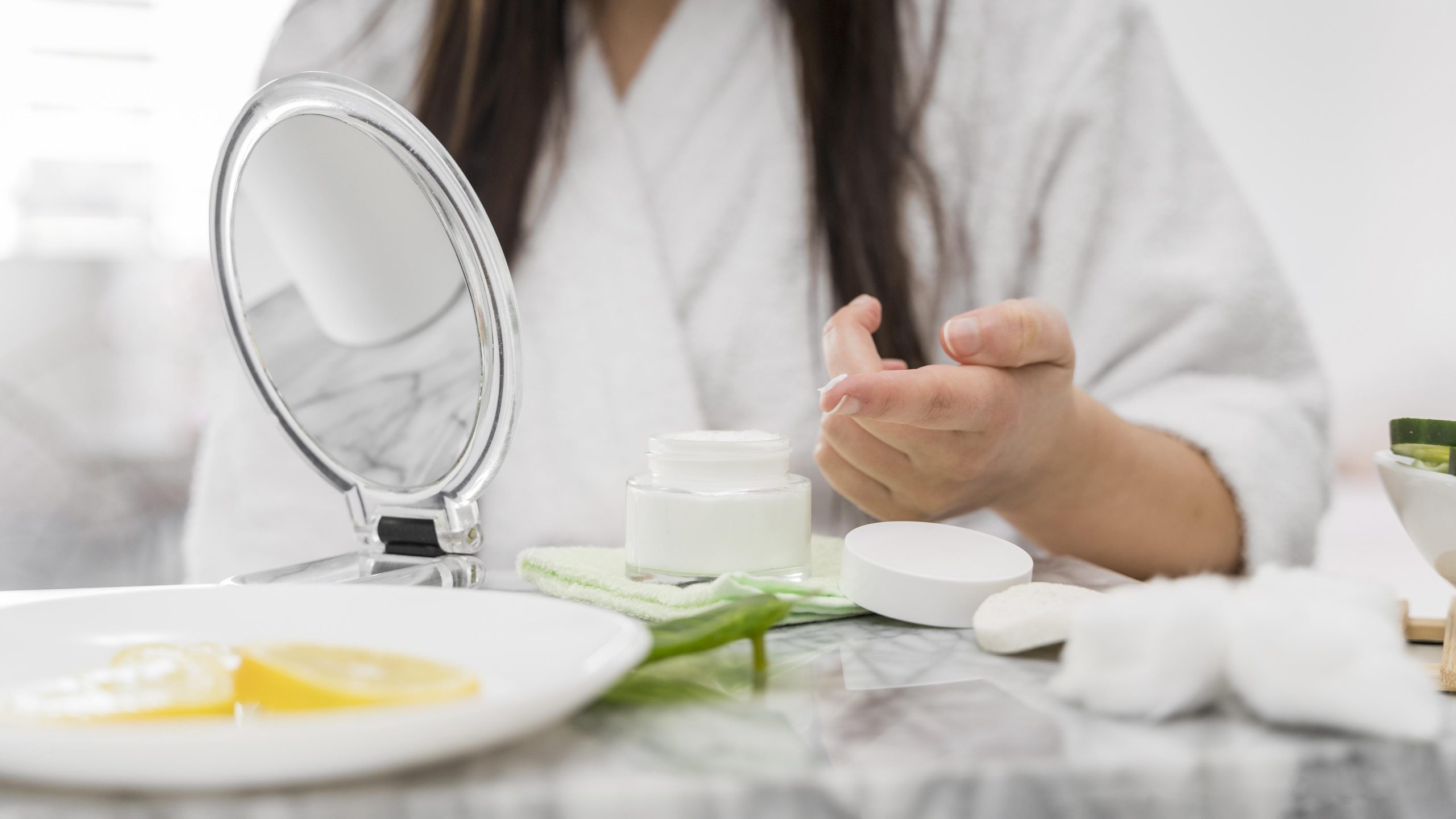 close up woman with cream finger